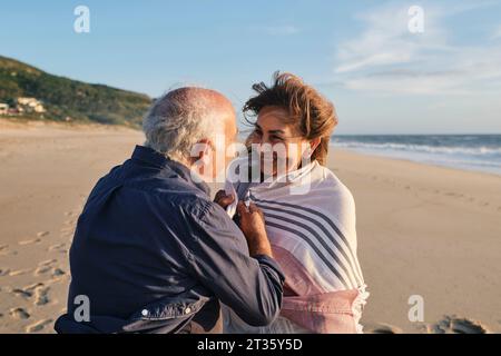 Loving senior couple enjoying vacations at beach Stock Photo