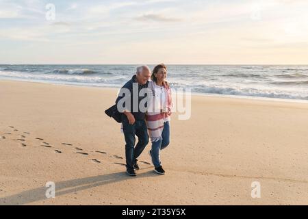 happy-senior-couple-walking-on-beach-stock-photo-alamy