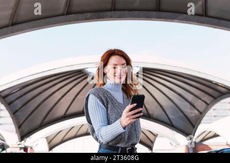 Happy woman using smart phone Stock Photo
