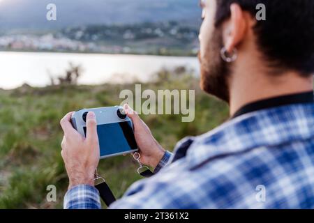 Man operating drone through controller Stock Photo