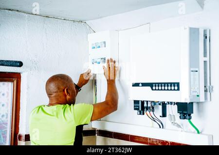 Engineer installing system in utility room Stock Photo