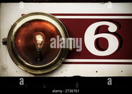 Number 6 painted in cream on red background on Manx Electric Railway  tram number 6 (1894), Isle of Man. Stock Photo