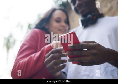 Young couple using smart phone Stock Photo