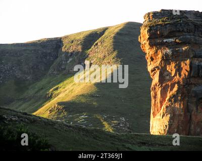 The majestic sandstone cliffs of the Brandwag Buttress, in the Golden Gate Highlands National Park  catching the last rays of the late afternoon Stock Photo