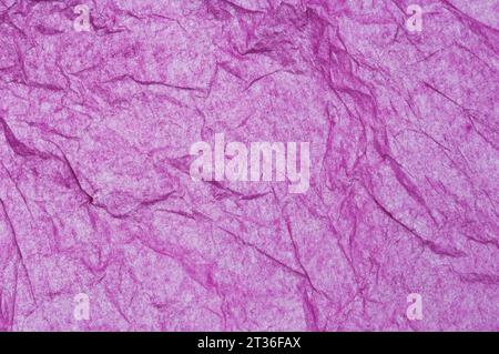 Full frame image of crumpled magenta tissue paper - John Gollop Stock Photo