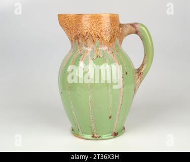 Stylish 1920-30s Art Deco pottery jug running crystalline glaze. Stock Photo