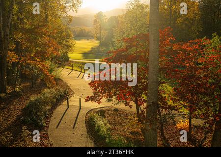 Golfers enjoying sunset on the links on a beautiful autumn day at the Brasstown Valley Resort Golf Course in Young Harris, Georgia. (USA) Stock Photo