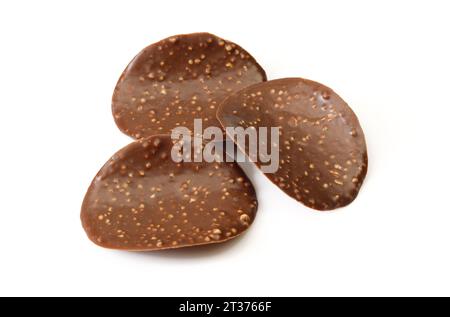 Three thin chocolate covered chips isolated on white background Stock Photo