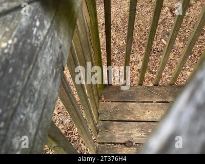 Rustic wooden deck corner old weathered fall leaves top down Stock Photo