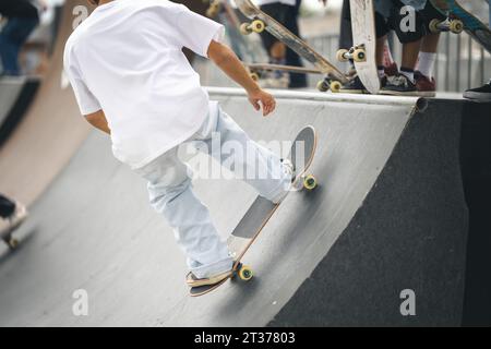 Skateboarder in mid-air, over a stair set. Stock Photo