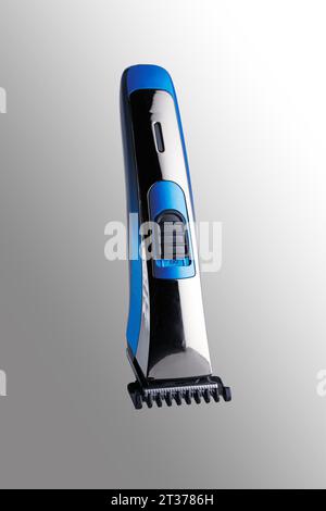 Beard and mustache trimmer. Close-up. Isolated on a gray background. Stock Photo