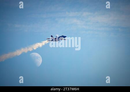 Miramar, California, USA - September 23, 2023: Blue Angel Number 3, LCDR Amanda Lee, passes in front of the moon at America's Airshow 2023. Stock Photo