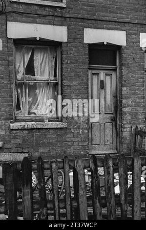 A house still being lived in amongst a row of Victorian terraced houses awaiting demolition during the slum clearance of St Ann's, Nottingham. 1969-72 Stock Photo