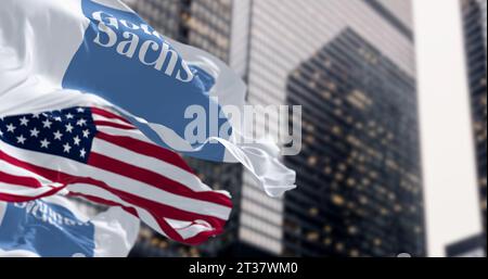 New York, US, Aug. 1 2023: Goldman Sachs bank and the United States flags waving in a financial district. Illustrative editorial 3d illustration. Fina Stock Photo