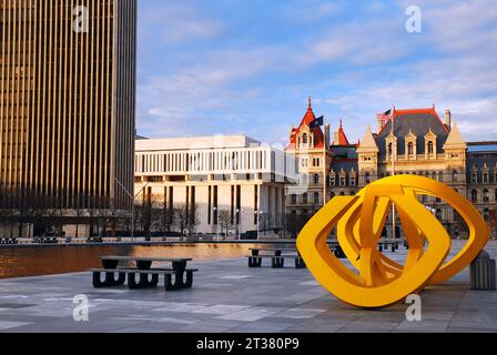 George Sugarman's yellow sculpture Trio stands next to the reflecting pool in Empire Plaza, center of politics in the New York State Capital in Albany Stock Photo