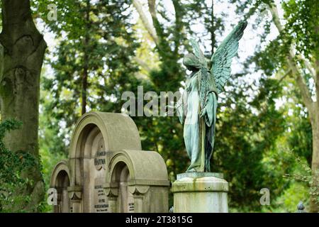 Cologne, Germany October 18 2023: historical tombs and winged angel figure at the enchanted melaten cemetery in cologne Stock Photo