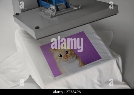Custom t-shirt. Using heat press to print photo of cute ginger cat Stock Photo