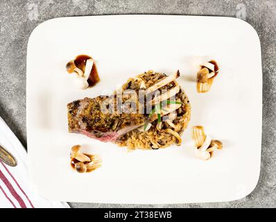 Above view of lamb with wild rice plated Stock Photo