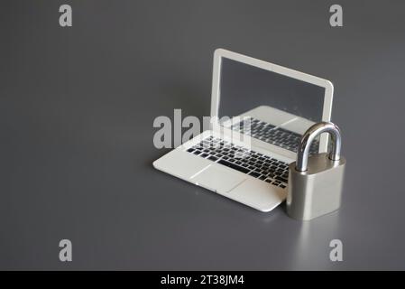 Closeup image of laptop and padlock with copy space. Cyber security concept. Stock Photo