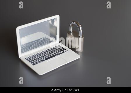 Closeup image of laptop and padlock with copy space. Cyber security concept. Stock Photo