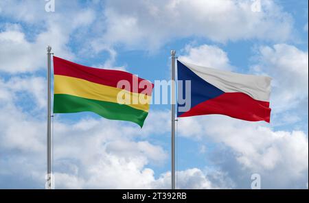 Czech Republic and Bolivia flags waving together on blue cloudy sky, two country relationship concept Stock Photo