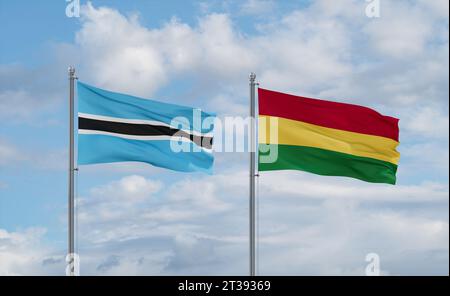 Botswana and Bolivia flags waving together on blue cloudy sky, two ...
