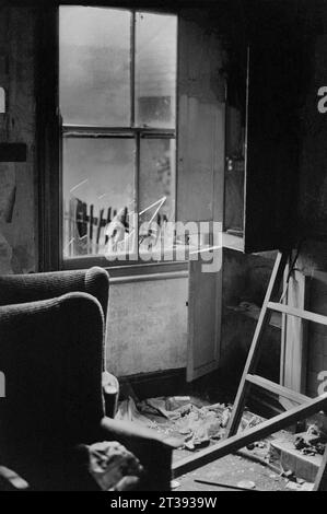 Front room full of furniture in a house that is awaiting demolition during the slum clearance of St Ann's, Nottingham. 1969-1972 Stock Photo