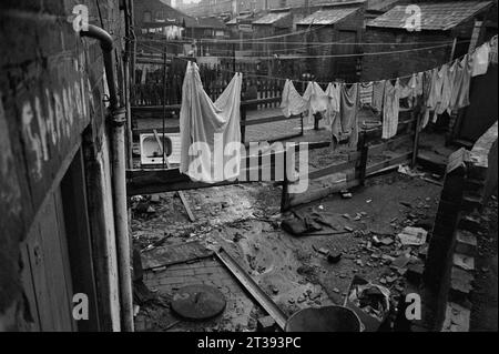 Washing hanging in the backyards of a street of terraced houses awaiting demolition during the slum clearance of St Ann's, Nottingham. 1969-1972 Stock Photo