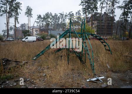 Irpin, Ukraine. 20th Oct, 2023. Equipment of a destroyed children's playground stands in high grass. The town near Kiev was partially destroyed by heavy fighting. In the meantime, reconstruction has progressed. Credit: Sebastian Gollnow/dpa/Alamy Live News Stock Photo