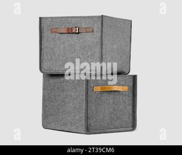 Gray felt organizer boxes with leather handles for storing things Stock Photo