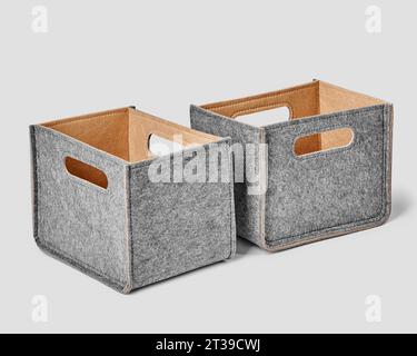 Two handmade gray felt boxes with handles for storing things Stock Photo