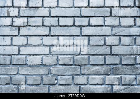 Vintage brick wall painted in silver color as abstract background Stock Photo