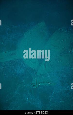 From above abstract background of blue water colors mixing painting on surface in studio during art season Stock Photo