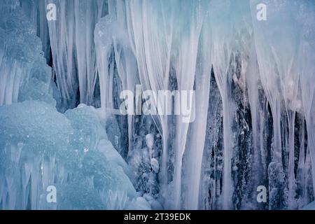 Close-up view of intricate ice formations and icicles against a snowy backdrop, capturing the serene beauty of winter in Cerler, Huesca, Spain Stock Photo