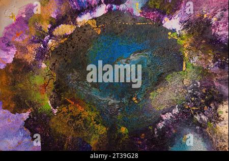 Painting of vibrant abstract artwork showcasing a rich amalgamation of colors including deep blues, purples, gold, and greens, creating a swirling cos Stock Photo