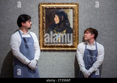 London, UK.  24 October 2023. Technicians present ‘Egyptian Woman (Coin Necklace)’, 1891, by John Singer Sargent (Est. US$1,200,000 - US$1,800,000) at Bonhams, New Bond Street.  The painting is one the highlights of the American Art collection of US journalist and television broadcaster Barbara Walters and the lots will be offered for sale at Bonhams New York on 6 November.     Credit: Stephen Chung / Alamy Live News Stock Photo