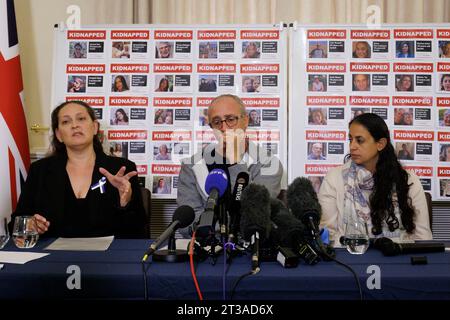 (left to right) British-Israeli Ayelet Svatitzky whose mother and brother were taken hostage from Kibbutz Nirim, British-Israeli David Barr whose sister-in-law Naomi was murdered on her morning run and British-Israeli Ofri Bibas Levy whose brother Jordan was taken hostage from his home in Nir Oz along with his wife Shiri and their children Ariel, four, and four-month-old Kfir during a press conference for the families of British-Israeli kidnap victims of the Israel-Hamas conflict, at the Israeli Embassy in London. Stock Photo