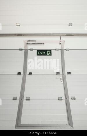 Rolled up metal door way on a warehouse entrance, abstract angle Stock Photo