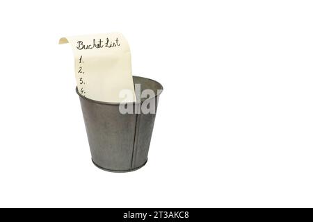 yellowed paper list in a vintage metal bucket, isolated on white background Stock Photo