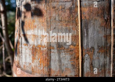 Obsolete wooden barrel with rust pattern, soft focus close up Stock Photo