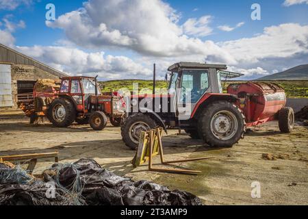 22.10.23 Ribblehead, North Yorkshire, UK. Red tractors parked at a farm near to Ribblehead Viaduct in the Yorkshire Dales Stock Photo