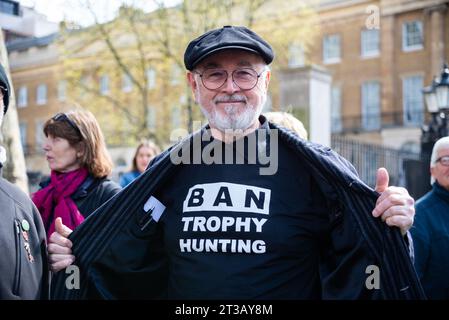 Peter Egan at a stop trophy hunting and ivory trade protest rally, London, UK. Wearing ban trophy hunting slogan shirt. Celebrity, actor Stock Photo