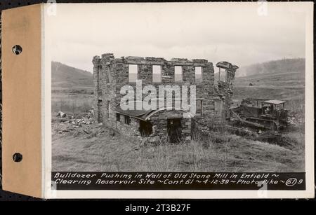 Contract No. 61, Clearing West Branch, Quabbin Reservoir, Belchertown, Pelham, Shutesbury, New Salem, Ware (including in areas of former towns of Enfield and Prescott), bulldozer pushing in wall of old stone mill in Enfield, Enfield, Mass., Apr. 12, 1939 Stock Photo