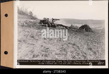 Contract No. 61, Clearing West Branch, Quabbin Reservoir, Belchertown, Pelham, Shutesbury, New Salem, Ware (including in areas of former towns of Enfield and Prescott), Oshkosh tractor dragging tree to fire, Enfield, Mass., Feb. 27, 1939 Stock Photo