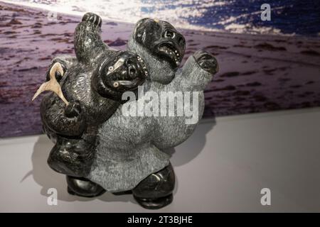 Canada, Nunavut, King William Island, Gjoa Haven. Nattlik Heritage Centre, interior. Traditional soapstone carving, bears. Stock Photo