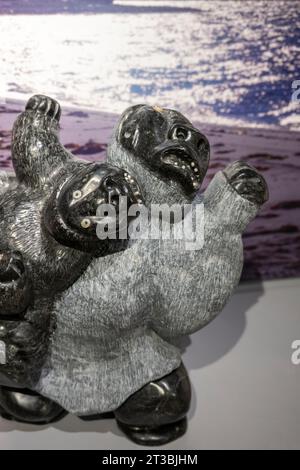 Canada, Nunavut, King William Island, Gjoa Haven. Nattlik Heritage Centre, interior. Traditional soapstone carving, bears. Stock Photo