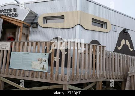 Canada, Nunavut, King William Island, Gjoa Haven, Nattlik Heritage Centre. Stylized muskox motif on exterior of building. Stock Photo