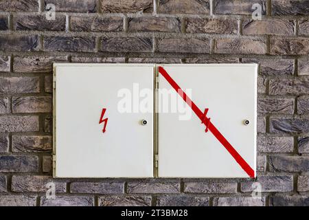 old electric box on the wall of a house Stock Photo