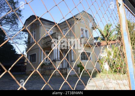 Facade of an old mansion in the interior of Brazil with an iron railing with no entry allowed Stock Photo