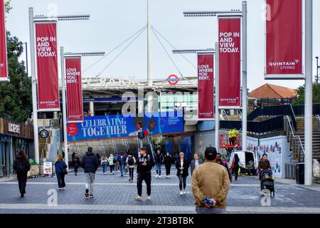 People walking along Olympic Way, Wembley Park, Borough of Brent, London, England, UK Stock Photo